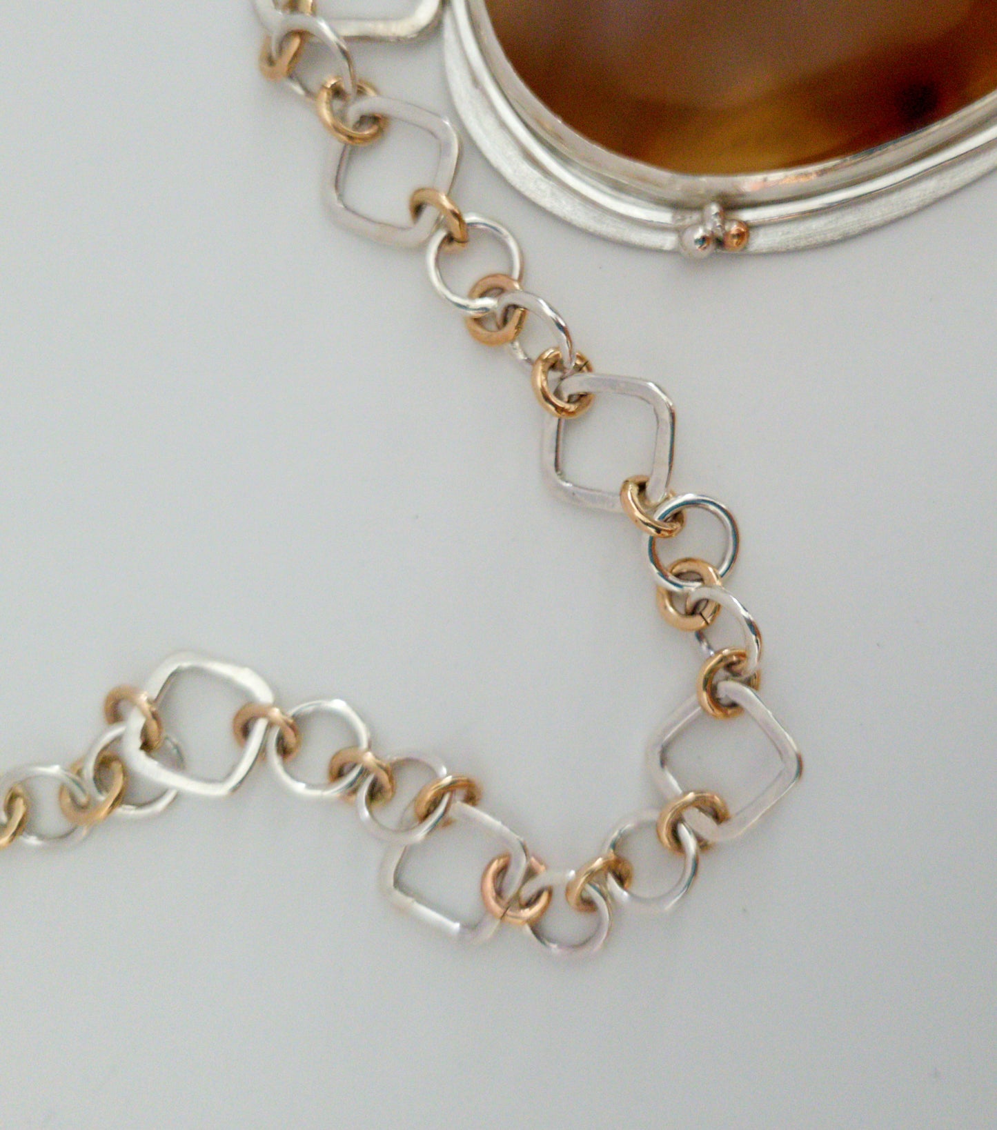 A Statement Pendant with Carnelian and Rhyolite Jasper